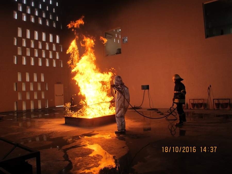 Firefighter suppression training at FCRC pool fire rig